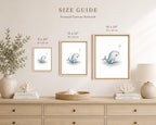 A size guide display for framed canvas wall art showing three versions of a whale illustration in different sizes: 8 x 10 inches, 11 x 14 inches, and 16 x 20 inches. The frames are hung on a beige wall above a light wood dresser decorated with a vase of greenery, books, and a lamp.