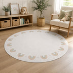 A round off-white area rug with a border of pastel rainbow arches, styled in a bright, modern children's playroom with a wooden floor, storage bench, and armchair.
