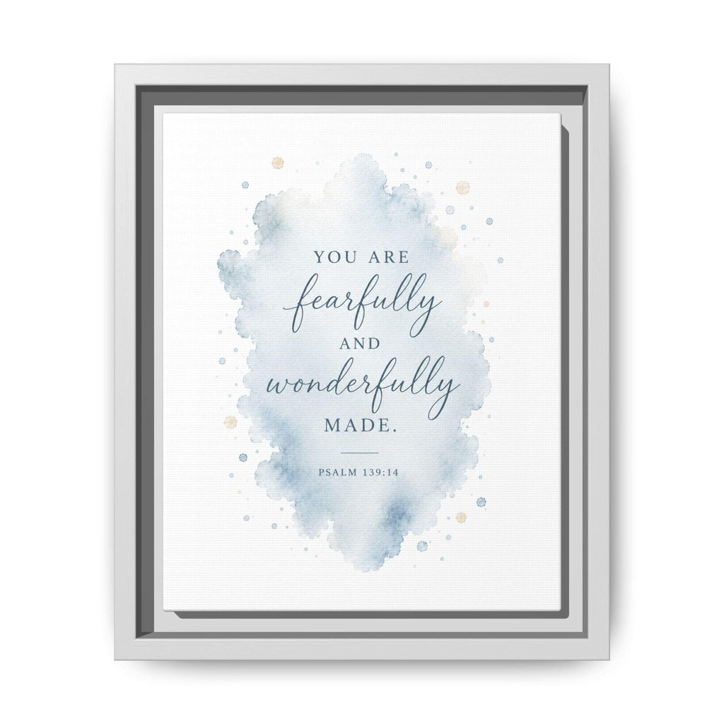 A framed typographic wall art print with a watercolor splash in soft blue and beige tones on a white background. The text reads, 'YOU ARE fearfully and wonderfully MADE.