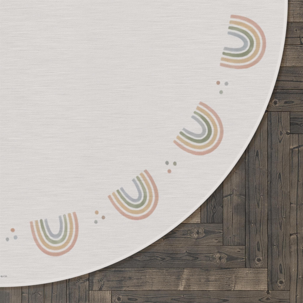 Close-up of pink and clear beaded strands on a dark surface with a white circular design in the background.