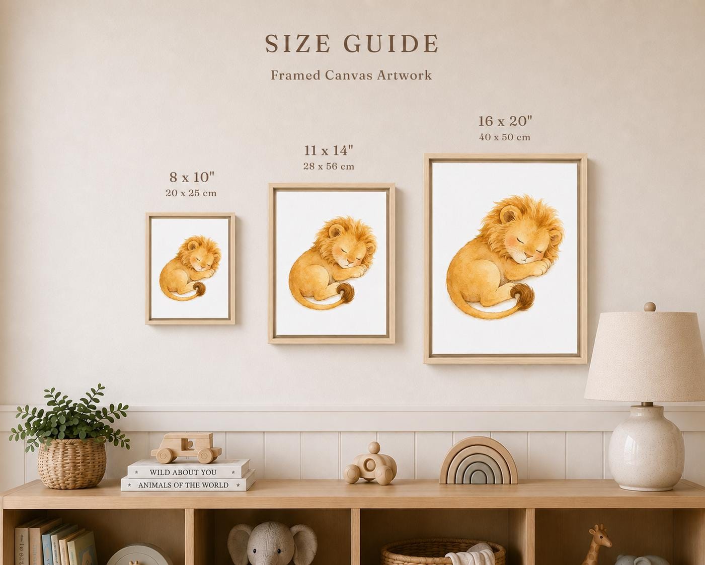 Three framed canvas prints of a sleeping lion in different sizes displayed on a beige wall above a wooden shelf with home decor. Text at the top reads 'SIZE GUIDE' with dimensions for each size.