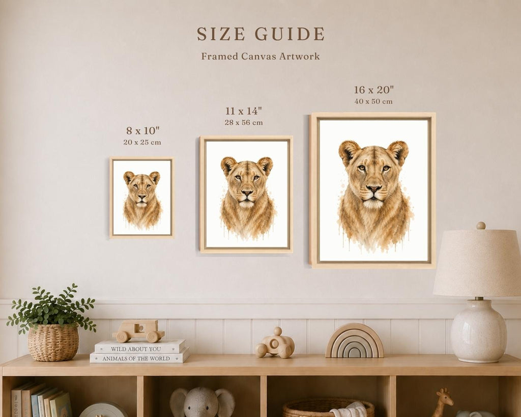 A size guide poster showing three framed canvas prints of lion cub portraits in different dimensions (8 x 10, 11 x 14, and 16 x 20 inches) mounted on a beige wall above a wooden shelf with home decor.