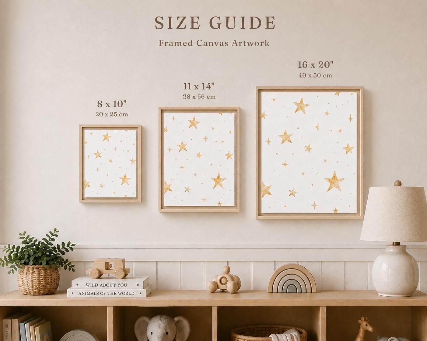 A size guide graphic showing three framed canvas art prints with gold star patterns on a warm beige wall above a wooden shelf. The text reads 'SIZE GUIDE Framed Canvas Artwork' with dimensions labeled for each frame: 8 x 10 inches, 11 x 14 inches, and 16 x 20 inches.
