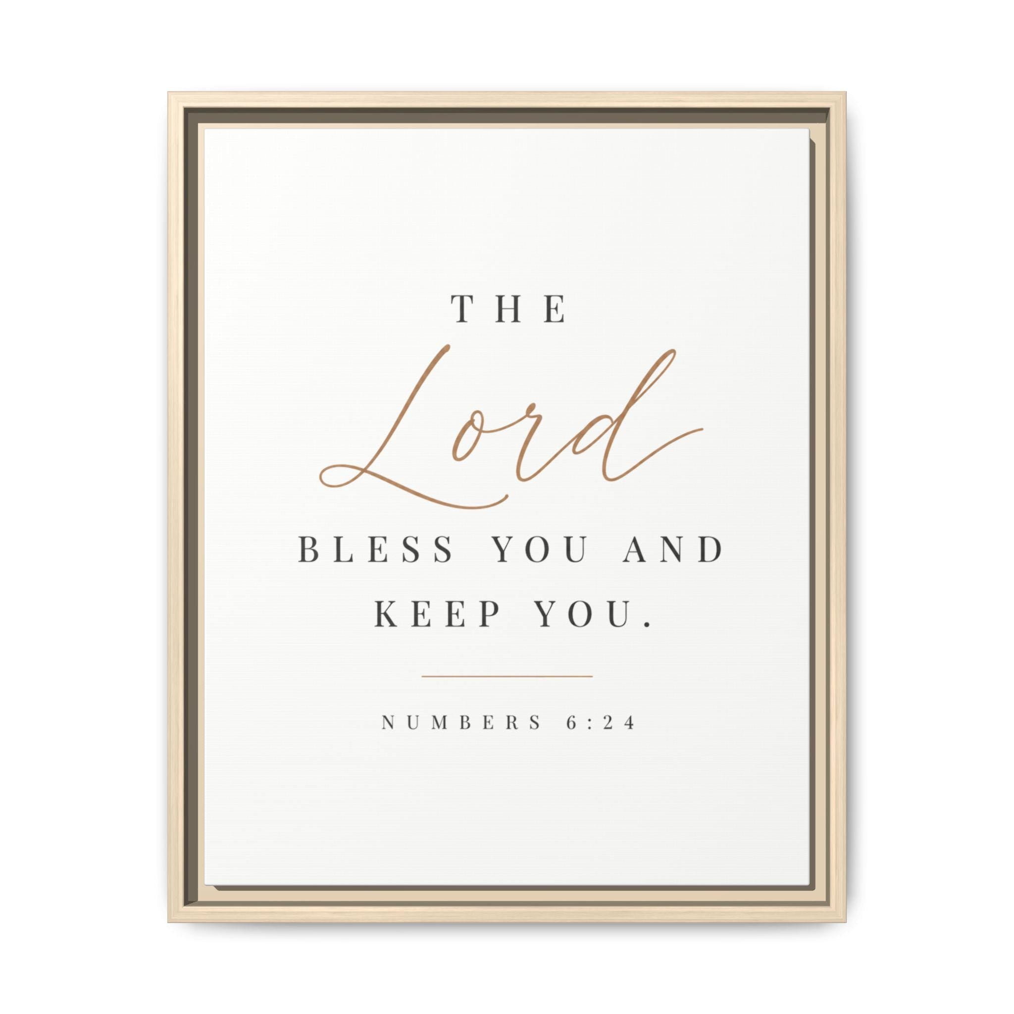 A framed typographic wall art print with the Bible verse 'The Lord bless you and keep you. Numbers 6:24' on an off-white background.