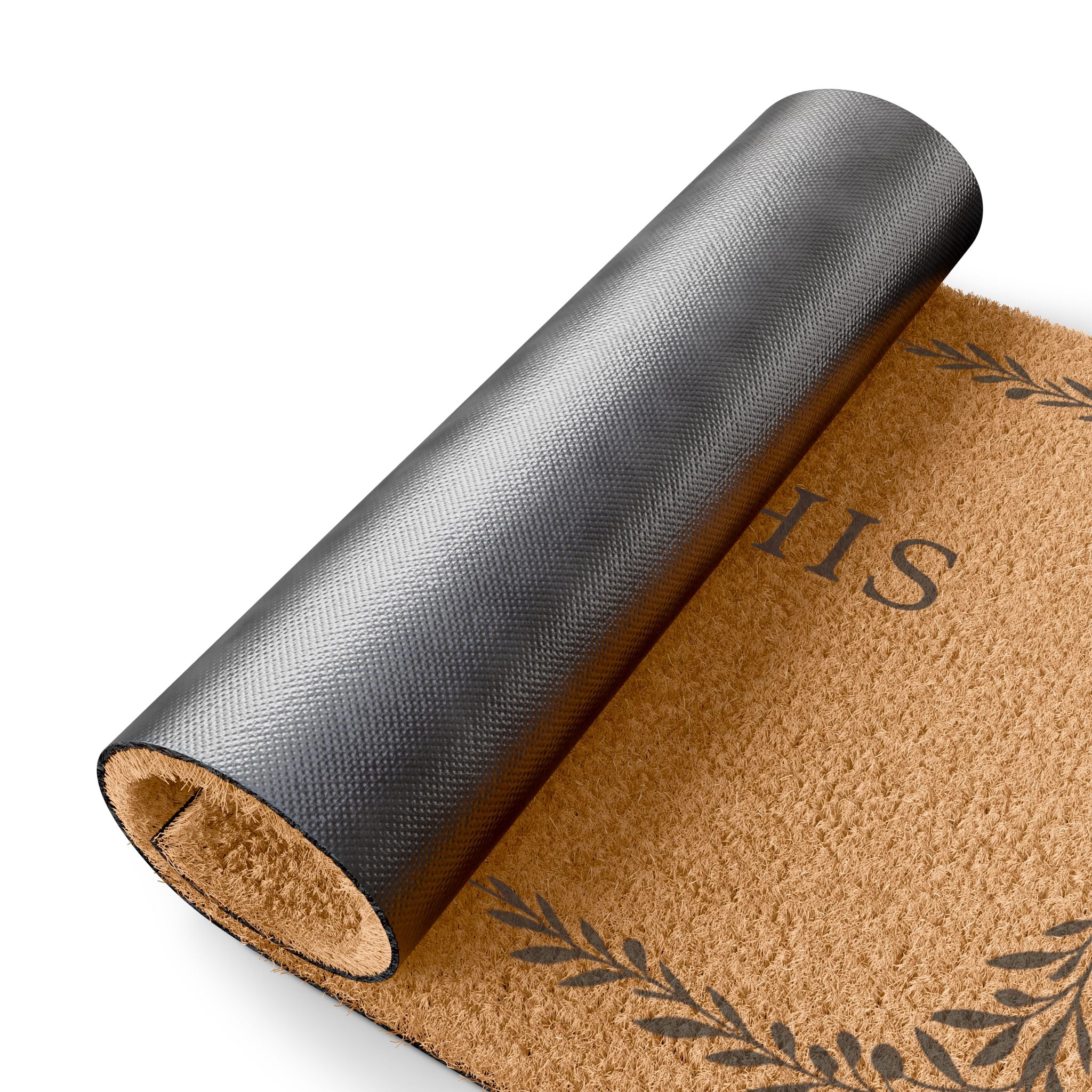 A rolled coir doormat with a dark gray protective outer cover partially peeled back, showing a natural tan coir texture and dark printed decorative motifs and lettering, on a white background.