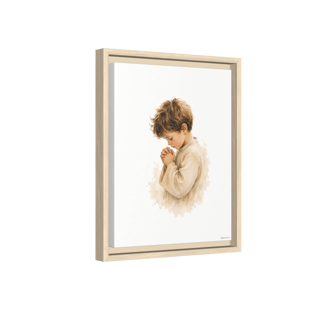 Framed wall art featuring a watercolor-style illustration of a young boy in a beige robe, shown in a light natural wood frame against a white background.