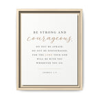 A framed inspirational Bible print featuring the quote 'BE STRONG AND courageous. DO NOT BE AFRAID; DO NOT BE DISCOURAGED, FOR THE LORD YOUR GOD WILL BE WITH YOU WHEREVER YOU GO.