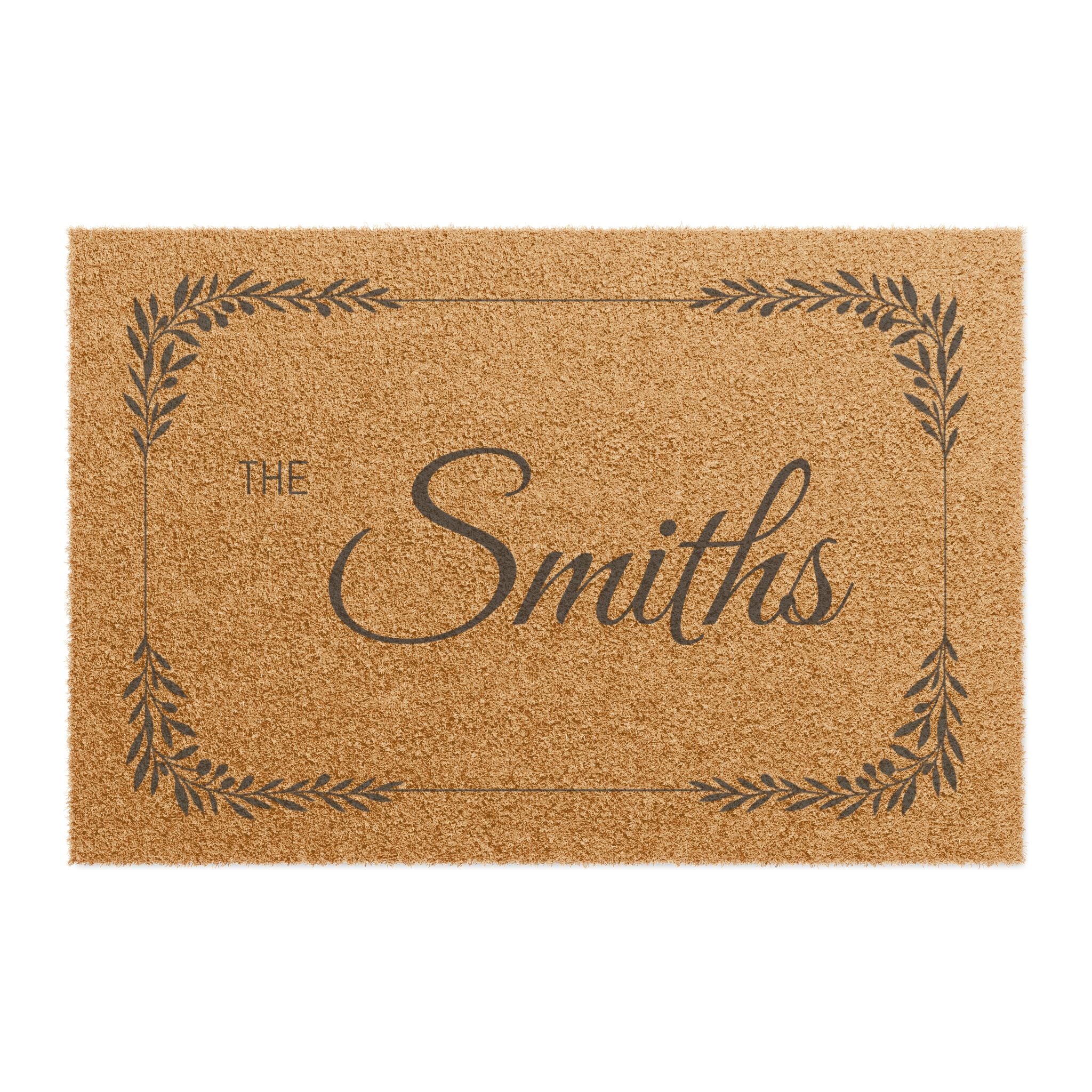 A rectangular natural coir doormat with a dark brown printed border, the words "THE Smiths" in script, and a personalized name design on a white background.