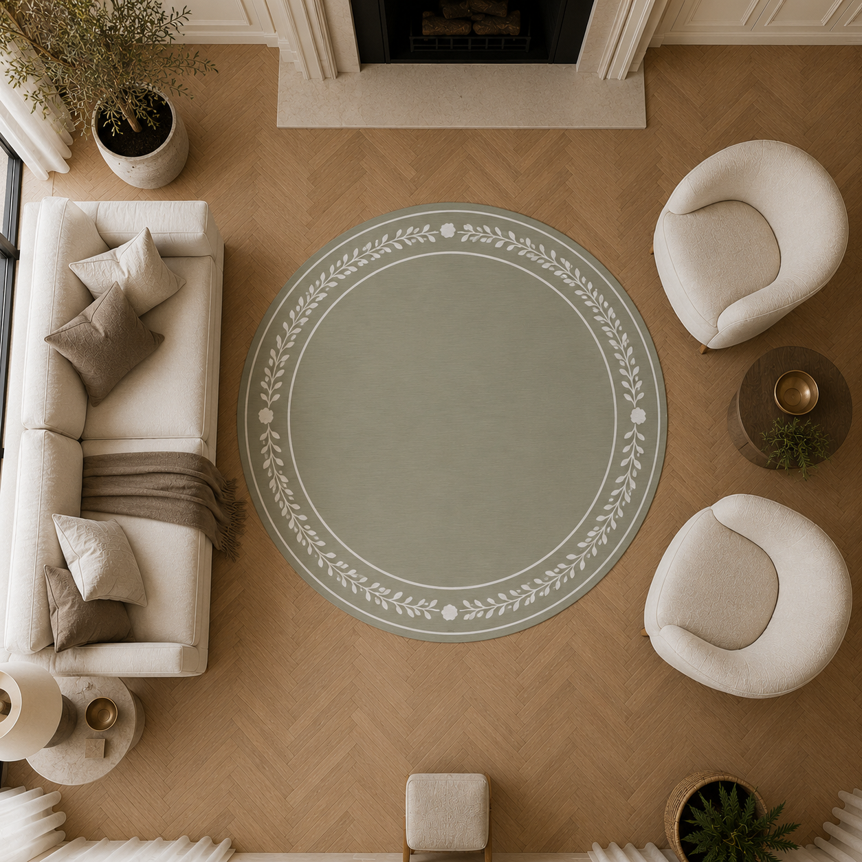 A round area rug in sage green with a white leafy floral border, styled in a bright, modern living room with a fireplace, cream-colored furniture, and wooden flooring.