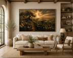 A large framed landscape art print depicting a golden sunset over a vineyard, displayed on a beige wall above a white sofa in a modern, rustic living room.
