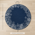 A round navy blue rug with a white nautical border featuring starfish, seashells, and coral, shown on a light wood floor with dimension lines indicating a 60-inch diameter and 60 by 60-inch size.