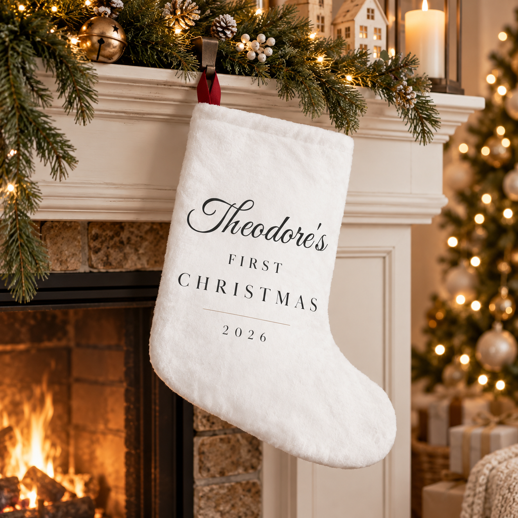 Baby's First Christmas personalized white stocking with baby's name in script and First Christmas 2026