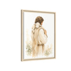 Framed watercolor art print depicting a shepherd carrying a white lamb on his shoulders, shown in a light wood frame against a white background.