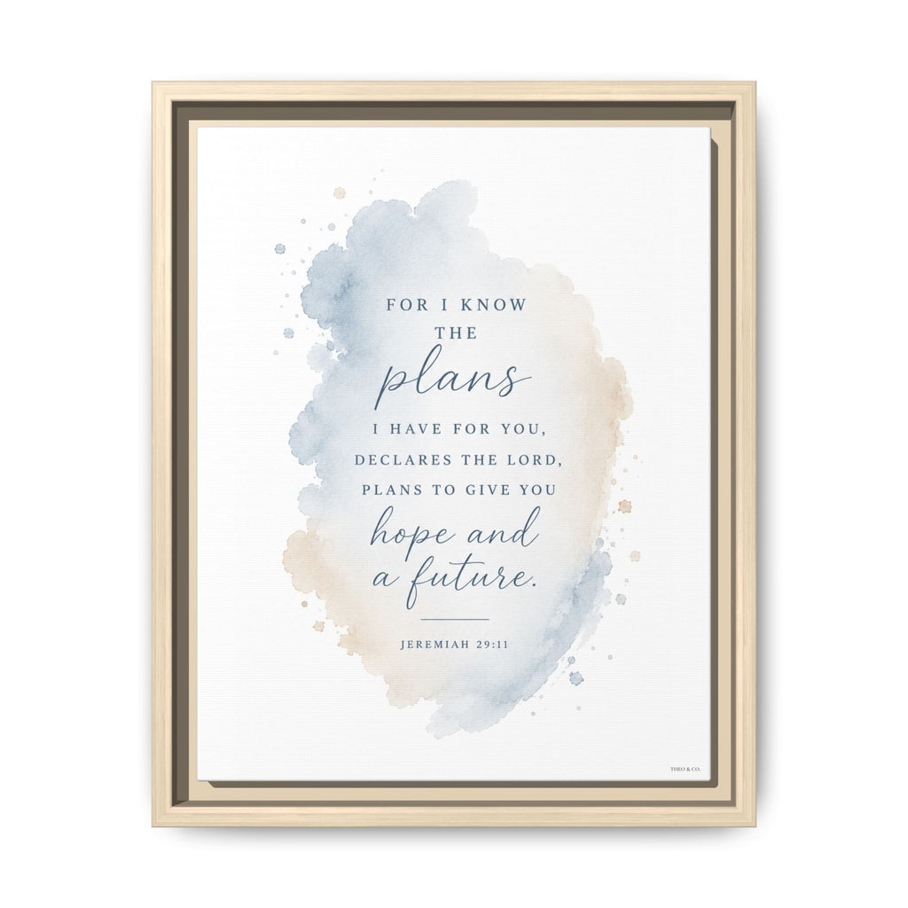 A framed inspirational Bible print featuring the quote 'For I know the plans declares the Lord, plans to give you hope and a future' from Jeremiah 29:11. The design has a soft blue and beige watercolor splash on a white background, enclosed in a light wood frame.