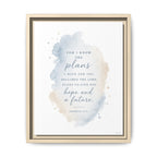 A framed inspirational Bible print featuring the quote 'For I know the plans declares the Lord, plans to give you hope and a future' from Jeremiah 29:11. The design has a soft blue and beige watercolor splash on a white background, enclosed in a light wood frame.