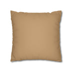A square throw pillow in a solid tan color, shown against a plain white background with a soft drop shadow.