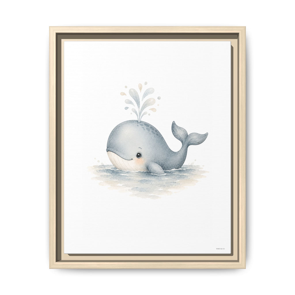 A framed watercolor art print featuring a cute gray baby whale swimming in light blue water with a small splash, set in a light beige double-frame against a white background.