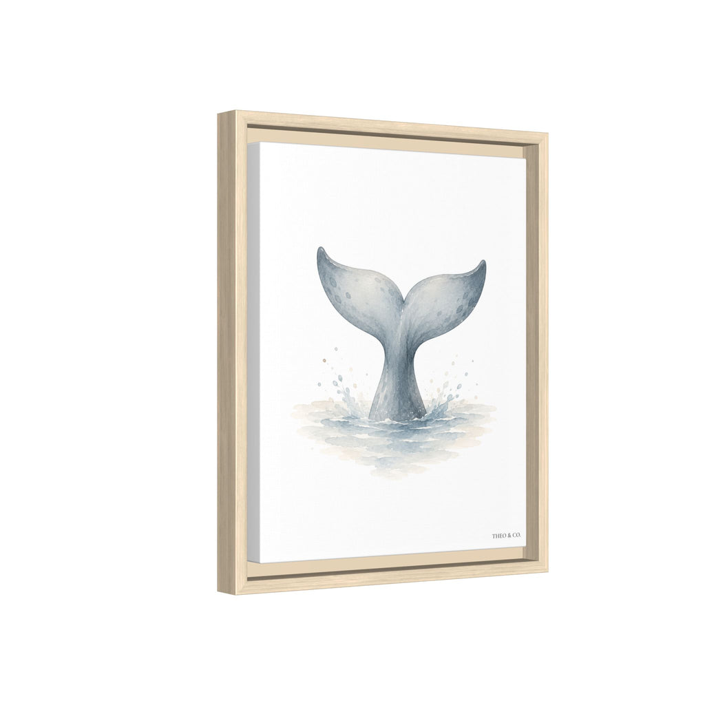 Framed wall art featuring a watercolor-style illustration of a gray mermaid tail rising from light blue water on a white background, shown in a light natural wood frame against a white backdrop.