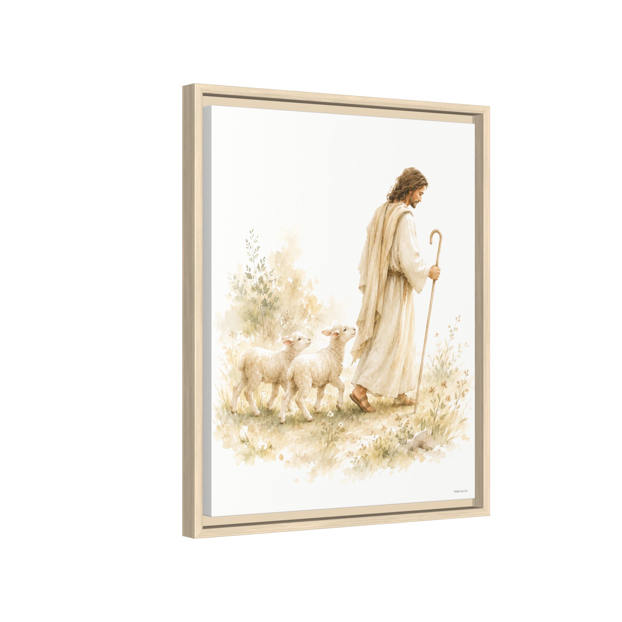 Framed wall art featuring a soft watercolor-style illustration of Jesus walking with two sheep, shown in a light wood frame against a plain white background.