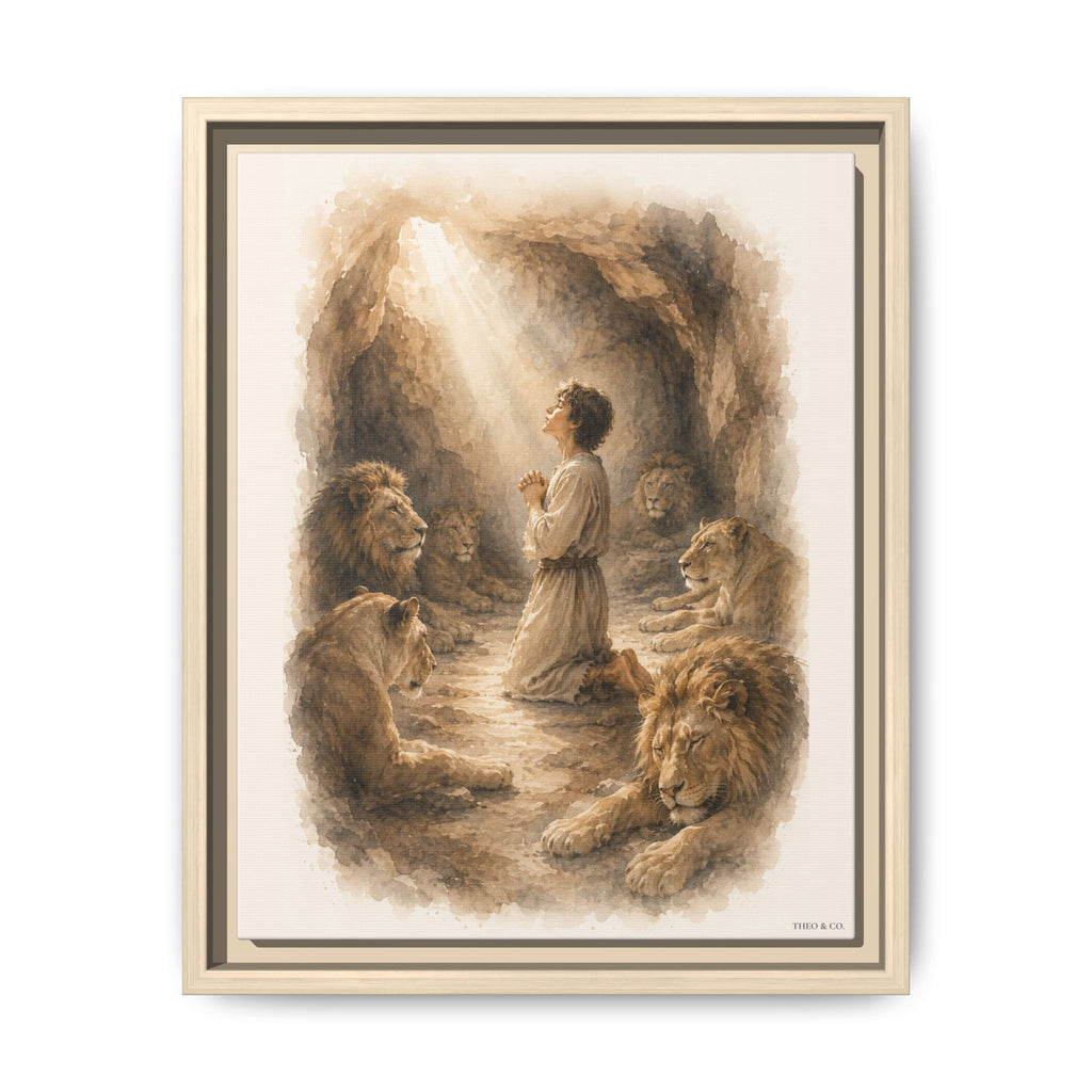 A framed art print depicting a biblical scene of Daniel praying in a den cave surrounded by lions, shown against a plain white background.