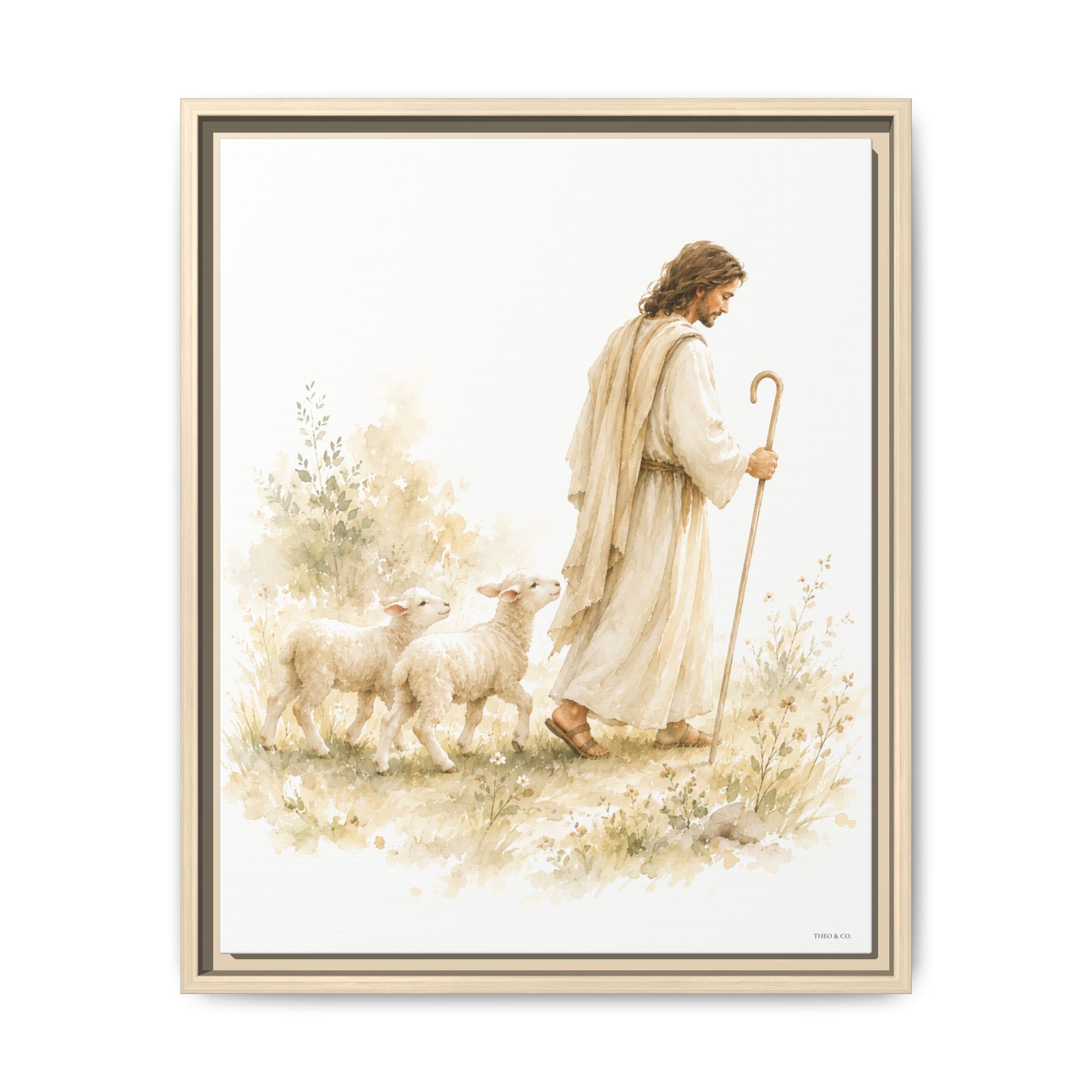 A framed art print featuring a watercolor-style illustration of Jesus walking with two sheep, shown against a clean white background.