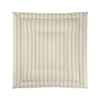 A square padded cushion with a striped pattern in beige and off-white, featuring a stitched border and a central square channel, shown against a plain white background.