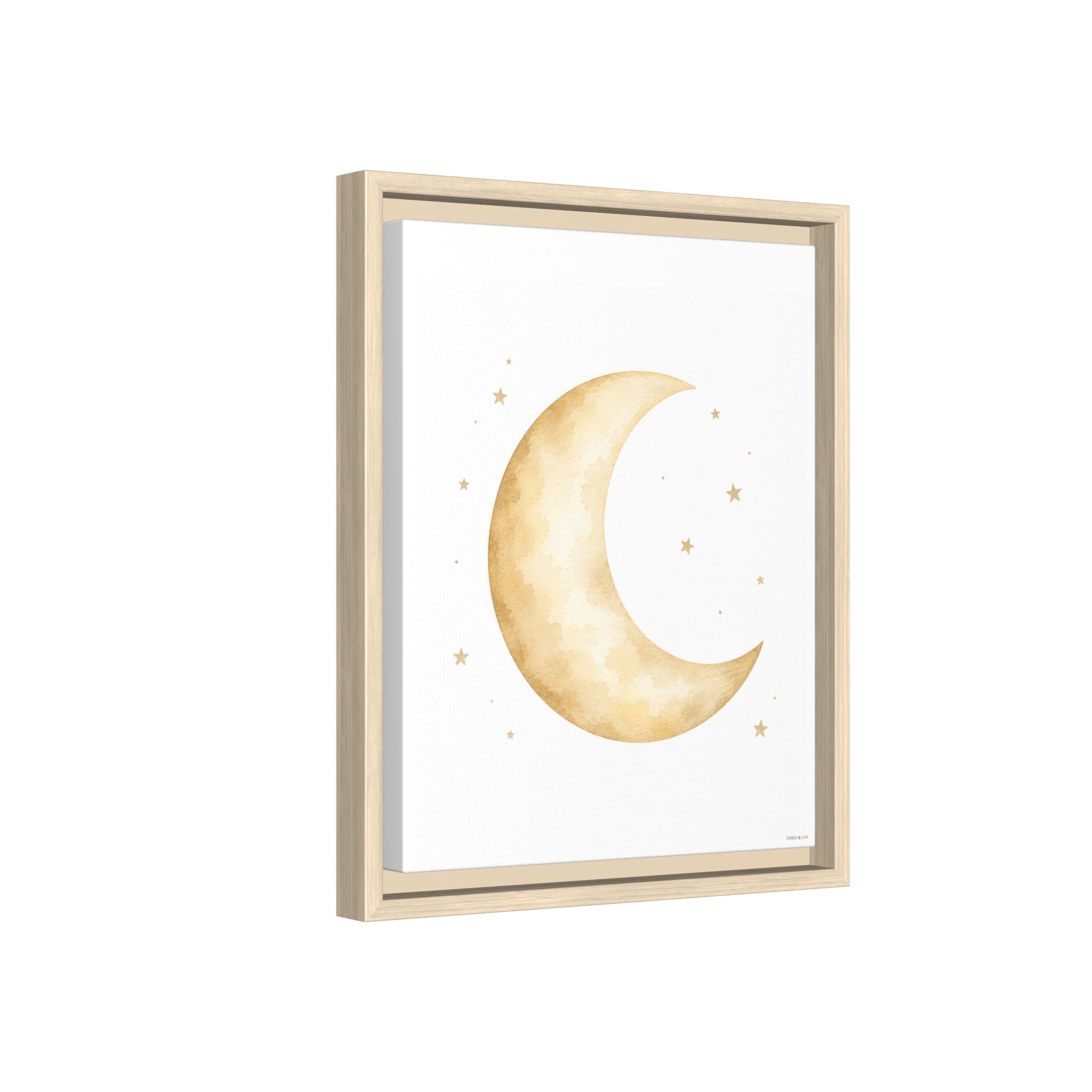 Framed wall art featuring a watercolor-style gold crescent moon and small stars on a white background, shown in a light natural wood frame against a white backdrop.