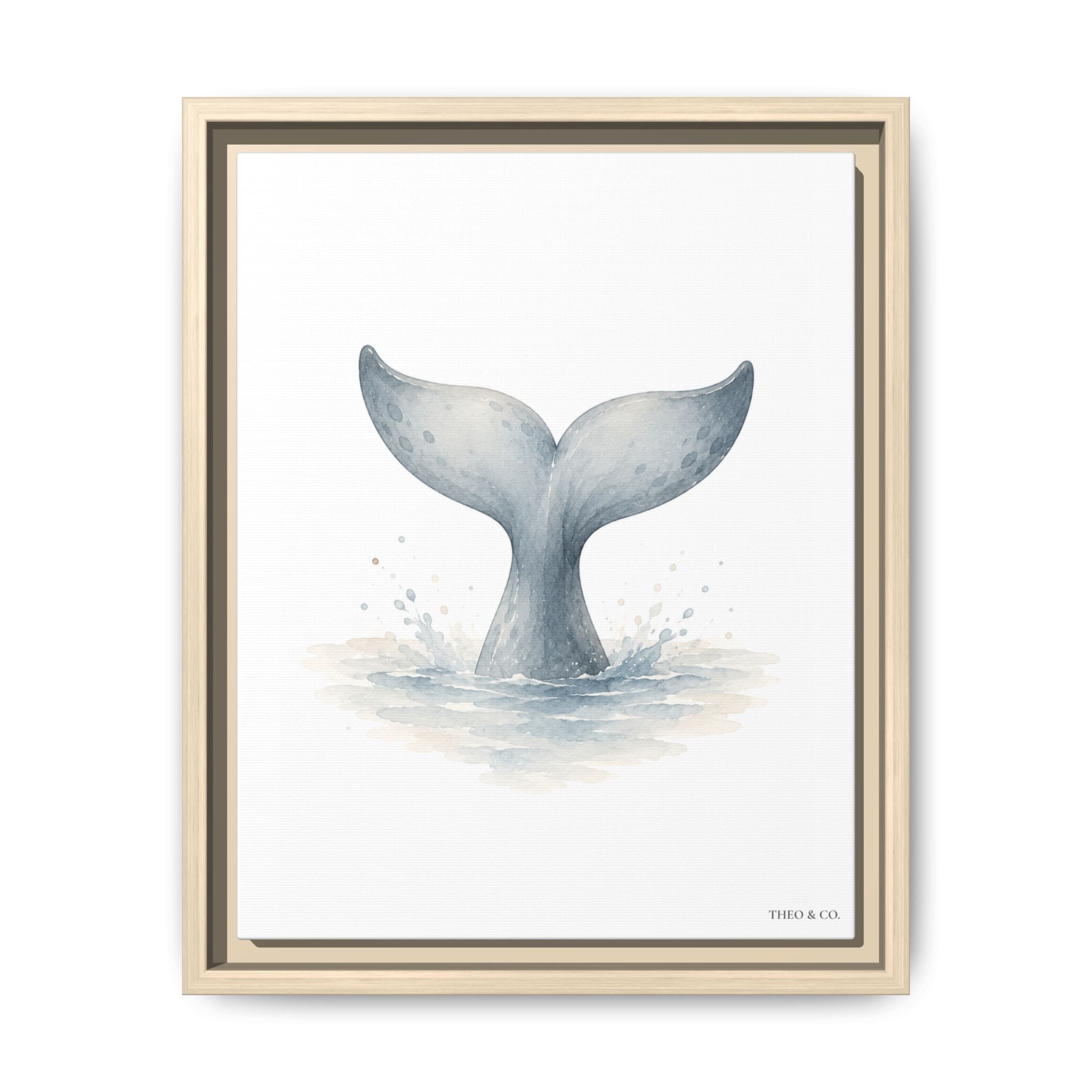 A framed art print featuring a watercolor illustration of a whale tail fin rising from the ocean, presented in a light natural wood frame against a clean white background.