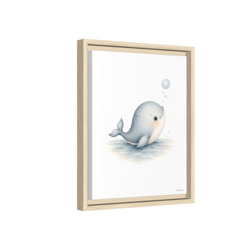A framed art print featuring a cute, stylized illustration of a light blue-gray beluga whale blowing a bubble, set in a light natural wood frame against a white background.