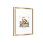 Framed wall art featuring a whimsical illustration of Noah's Ark with cartoon animals including a giraffe, elephant, lion, and cat on a white background, shown in a light natural wood frame against a white backdrop.